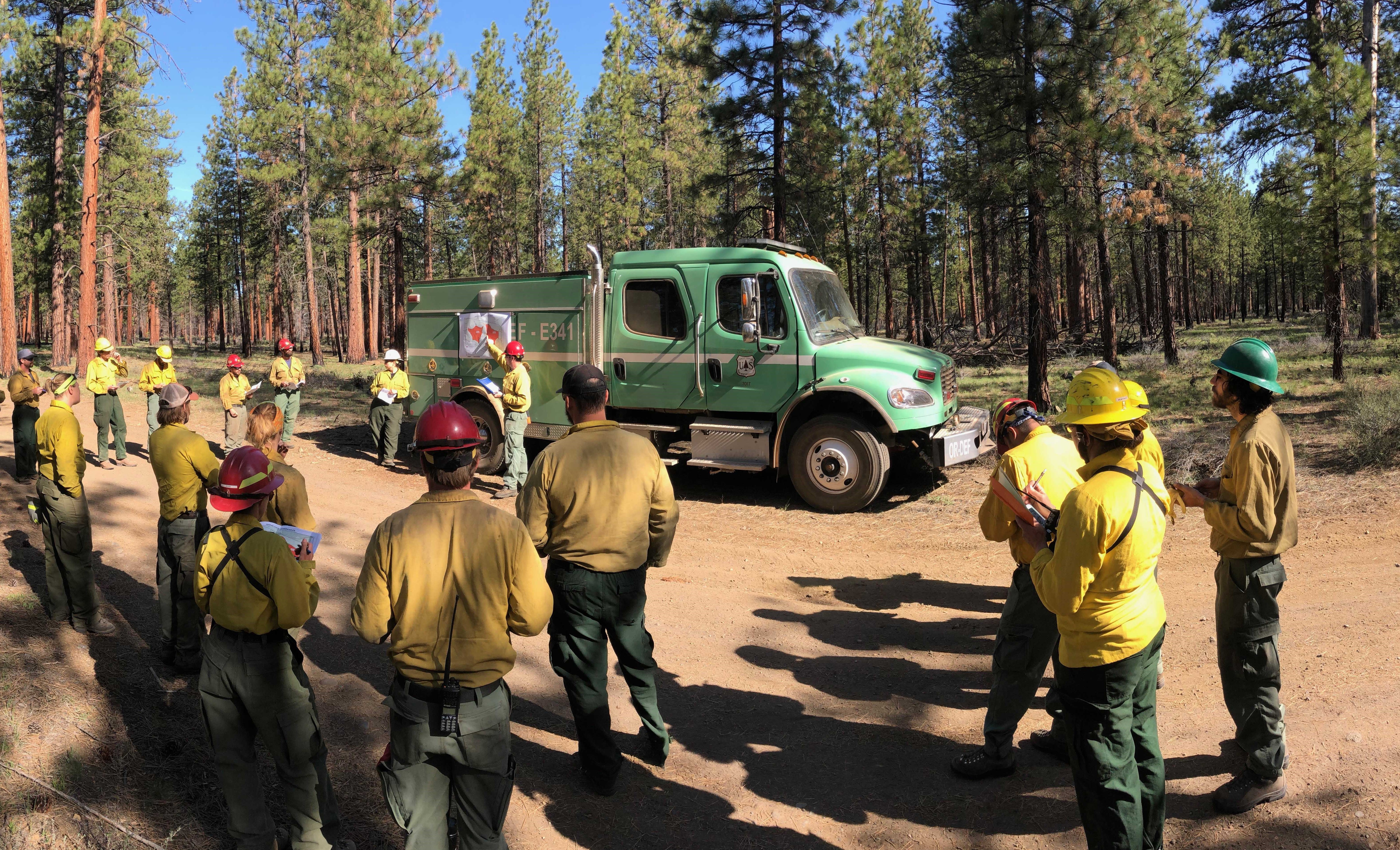 A team of firefighters prepare for a controlled burn in Oregon. © Mitch Maxson.