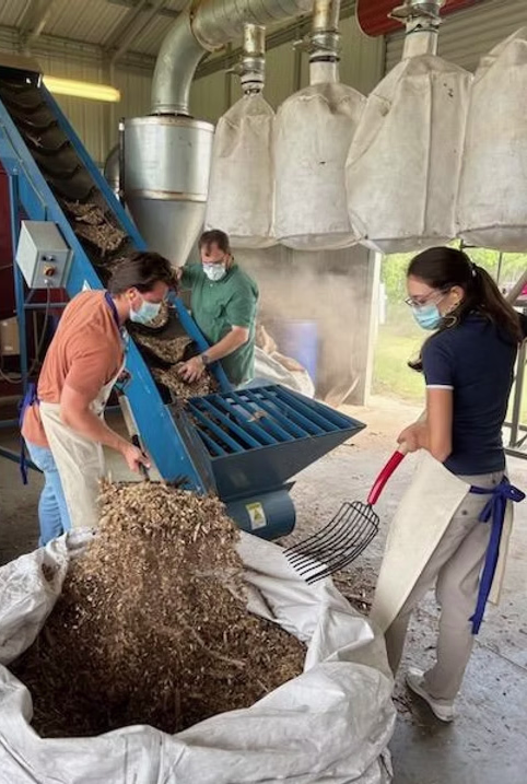 North Carolina State students working with wood chip samples from Plumas Wood Fiber.