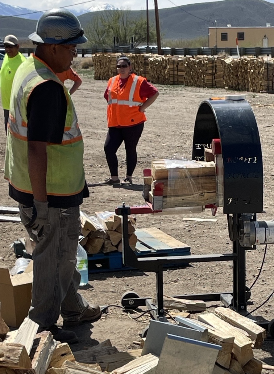 Field crew member operating electric wrapper at Washoe Wood Yard. Photo by Scott Burdette, USFS.